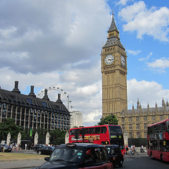 Big Ben, a black cab, and a red double-decker bus in Parliament Square