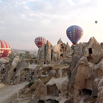 Hot air balloon over the rock formations in the Cappadocia region