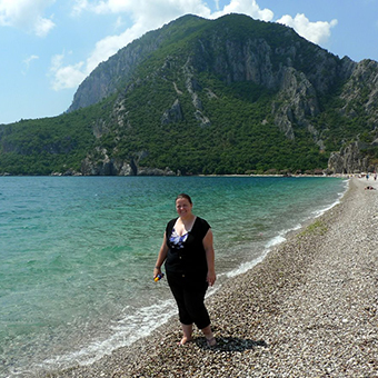 Kim standing along the beach in Çirali